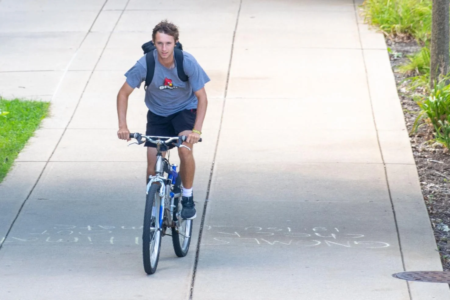 ISU student biking through campus